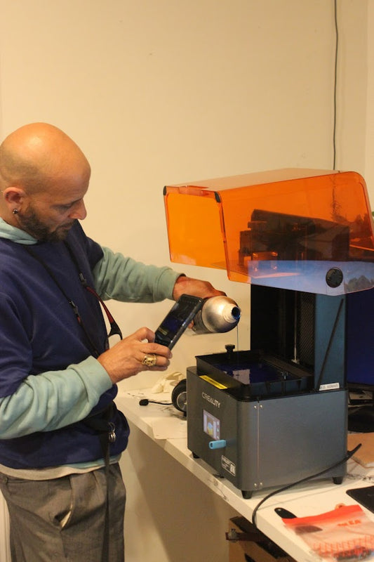 Behind the Scenes: Miguel Setting Up Our 3D Printer