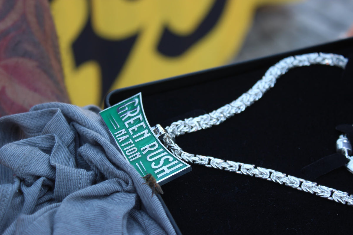 Green Rush Nation pendant in silver with green glow enamel