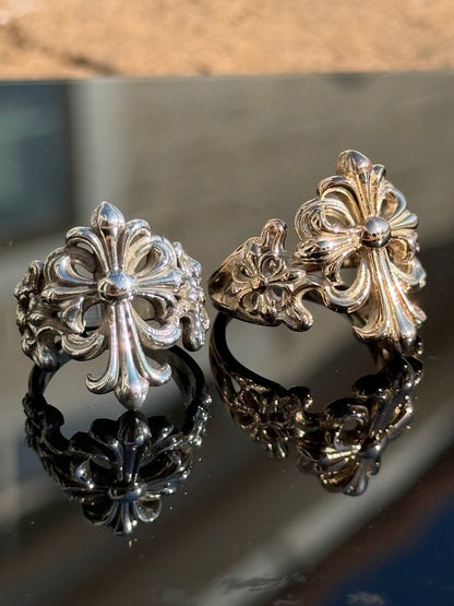Fleur-de-Lis Cross Ring in sterling silver, beside the gold version · Lukali & Co