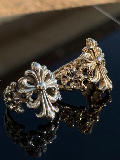 Fleur-de-Lis Cross Ring in sterling silver, beside the gold version · Lukali & Co