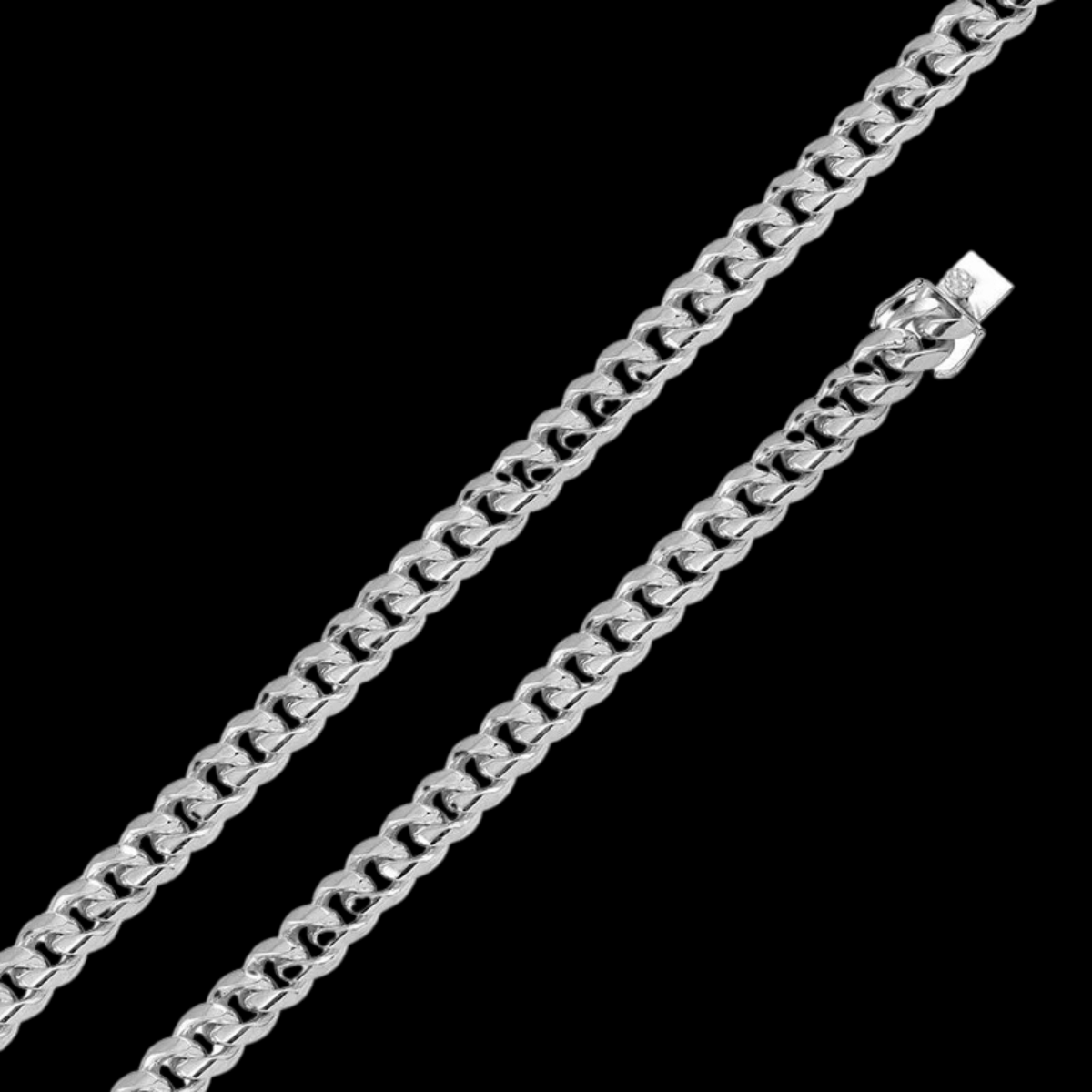 Crafted for both strength and style, our 10.9mm Silver Cuban Link Bracelet is a bold statement piece that embodies timeless elegance and modern masculinity. Made from high-quality sterling silver, this bracelet features a robust 10.9mm width that adds a touch of sophistication to any look, whether casual or formal. Each link is meticulously crafted for a smooth, comfortable fit and polished to a high shine for maximum impact. Securely fastened with a durable box lock, this piece promises both style and dura